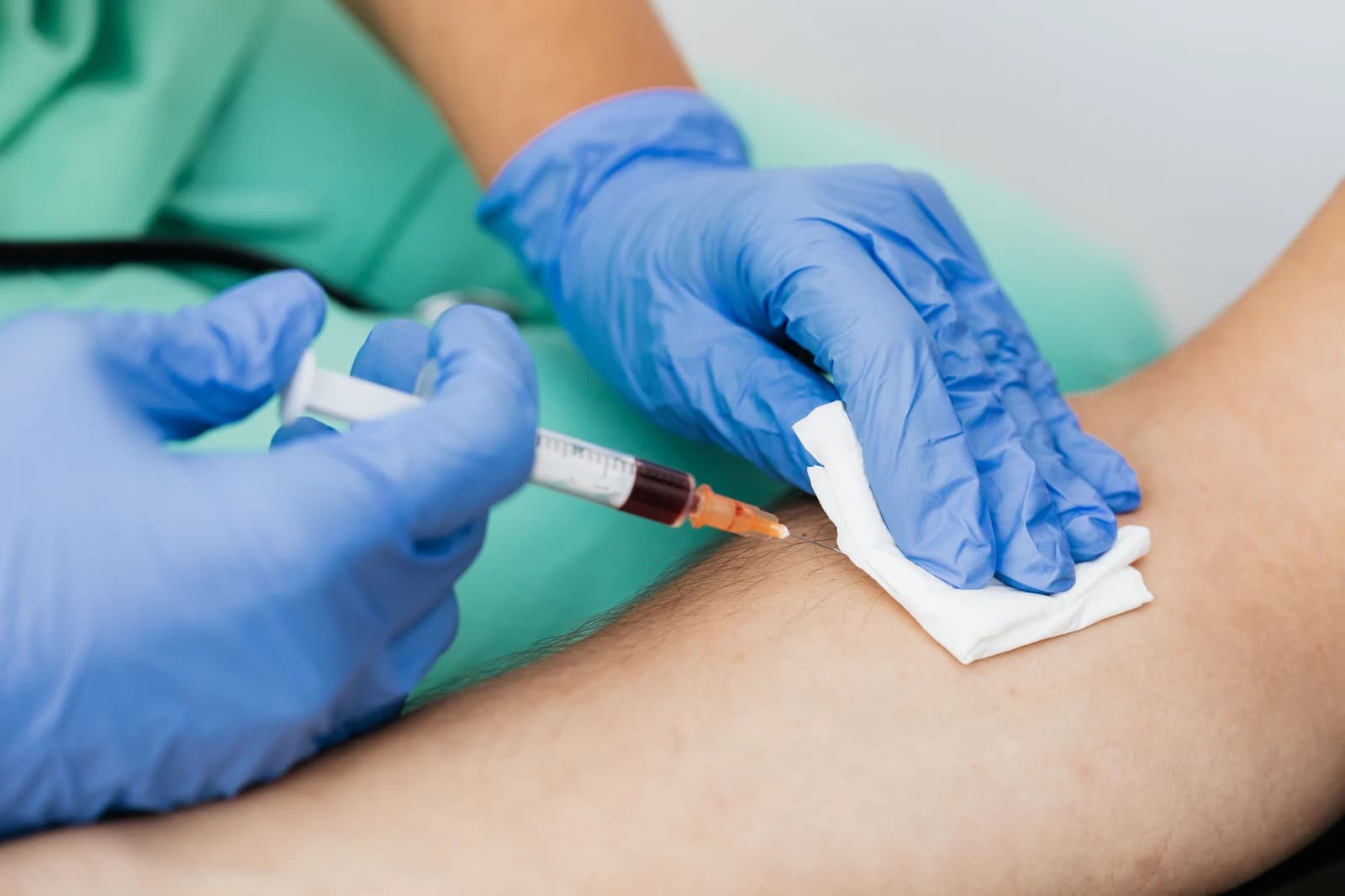 Clinician preparing a venous treatment